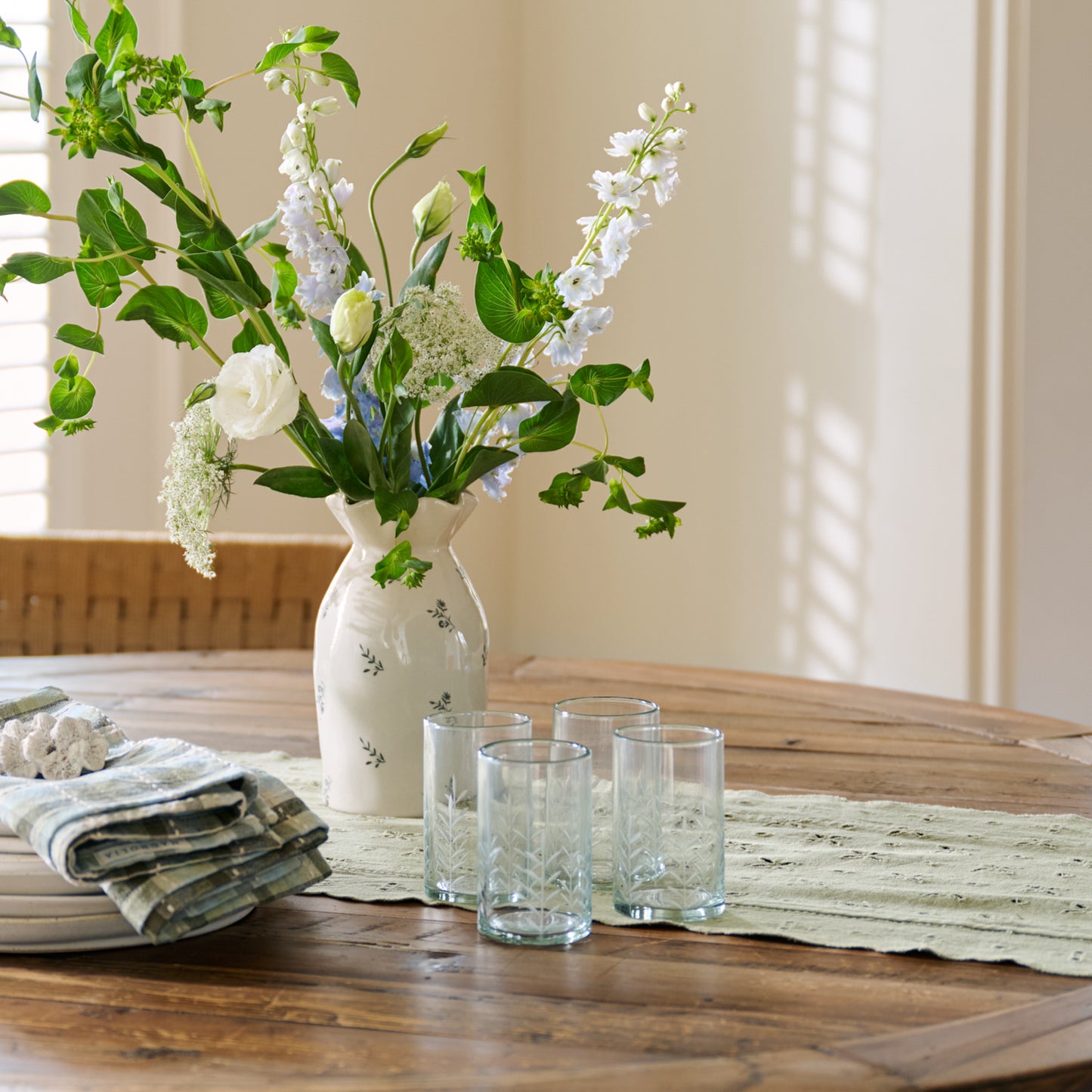 Marlowe Etched Glass Tumbler on a table
