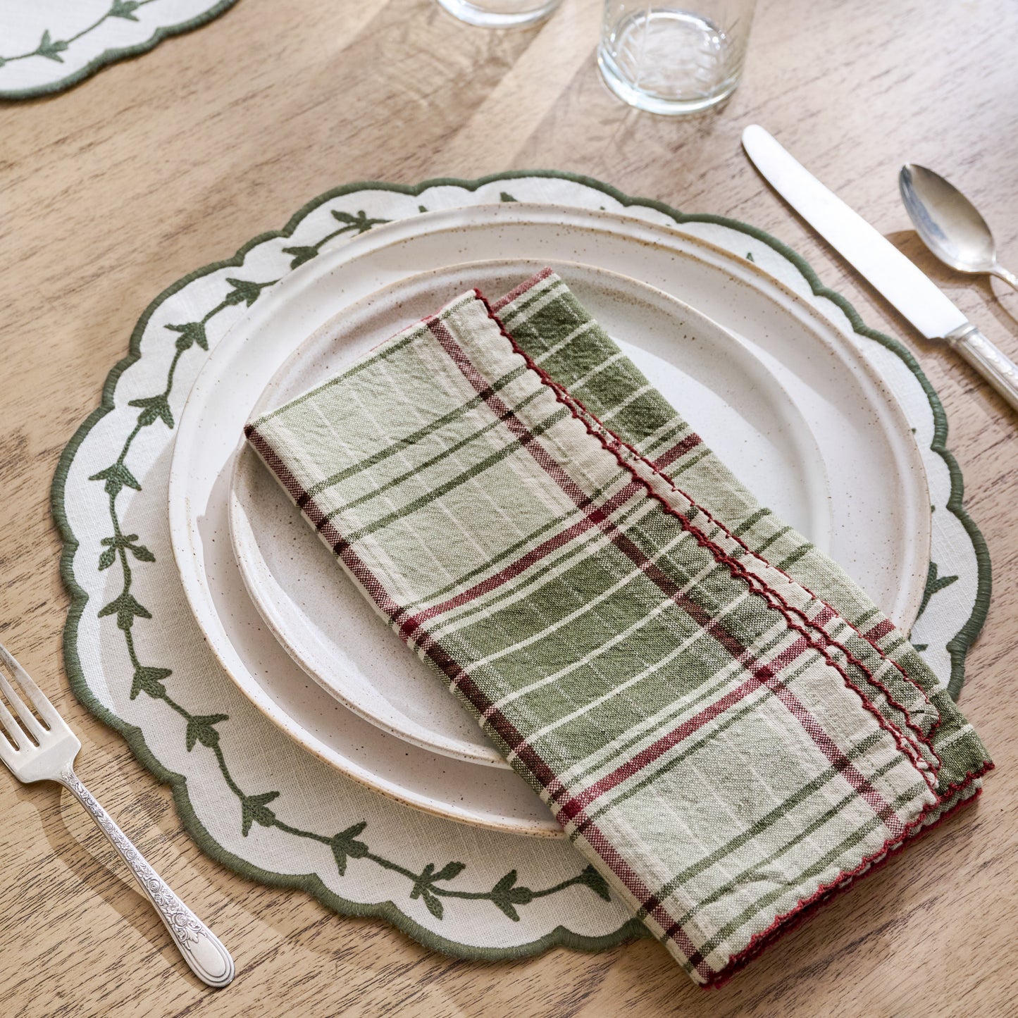 Green Embroidered Edge Scallop Reversible Placemat shown on table setting