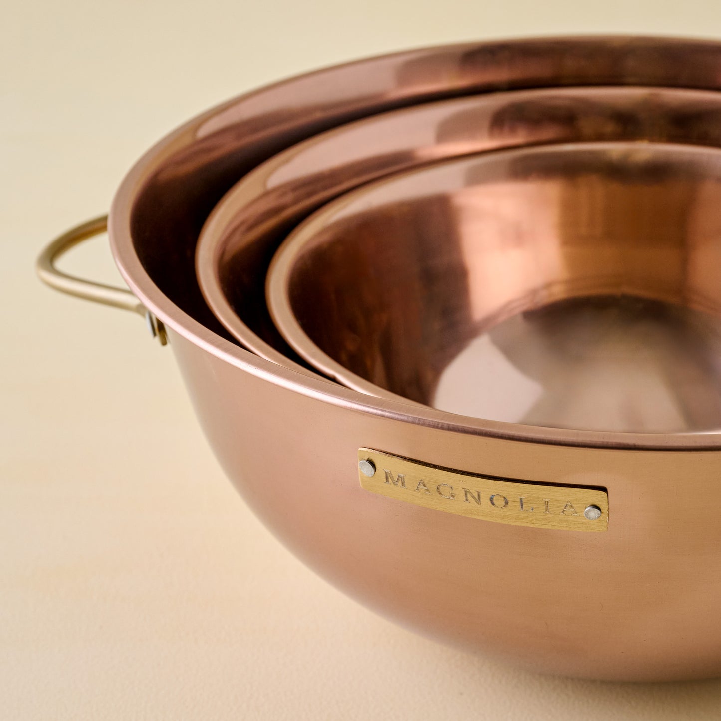 Magnolia Copper Mixing Bowl Set close up and stacked inside large mixing bowl