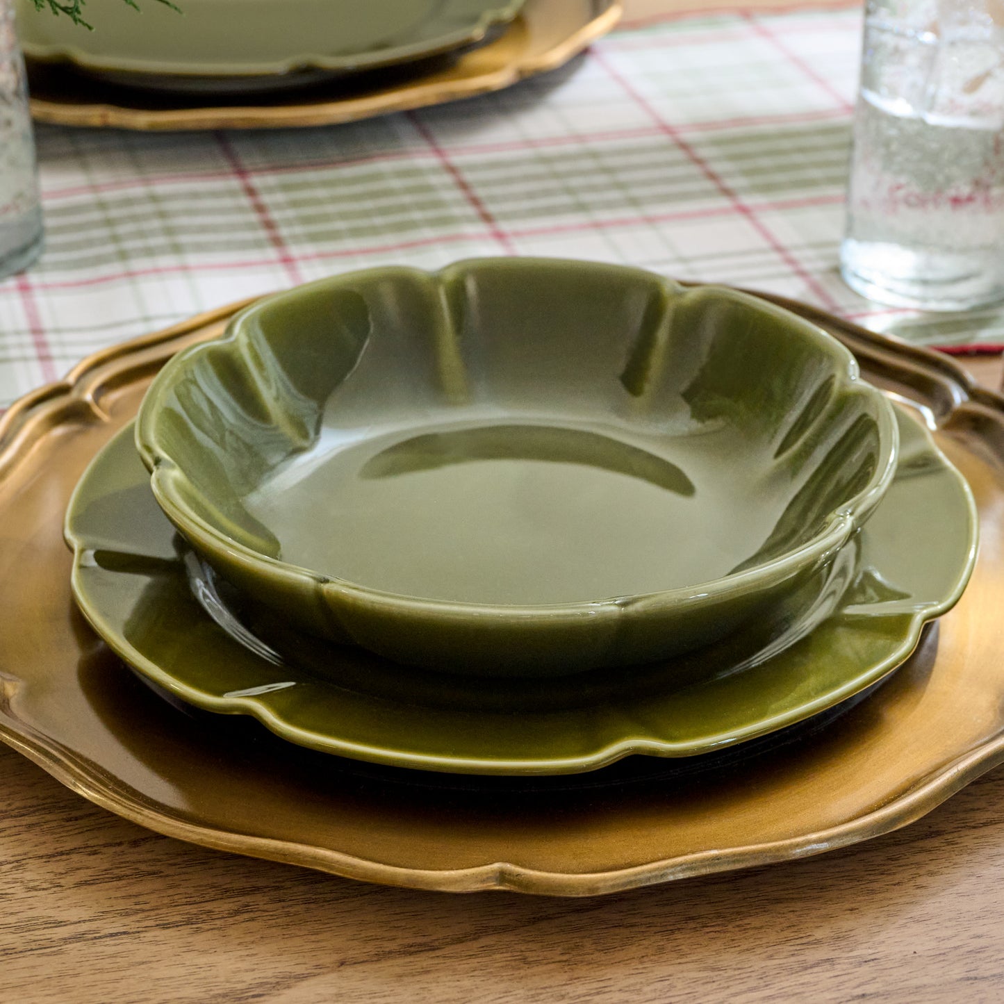 Fern Green Luna Scalloped Pasta Bowl shown on table setting