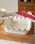 French White Scalloped 9x9 Baking Pan shown set on counter
