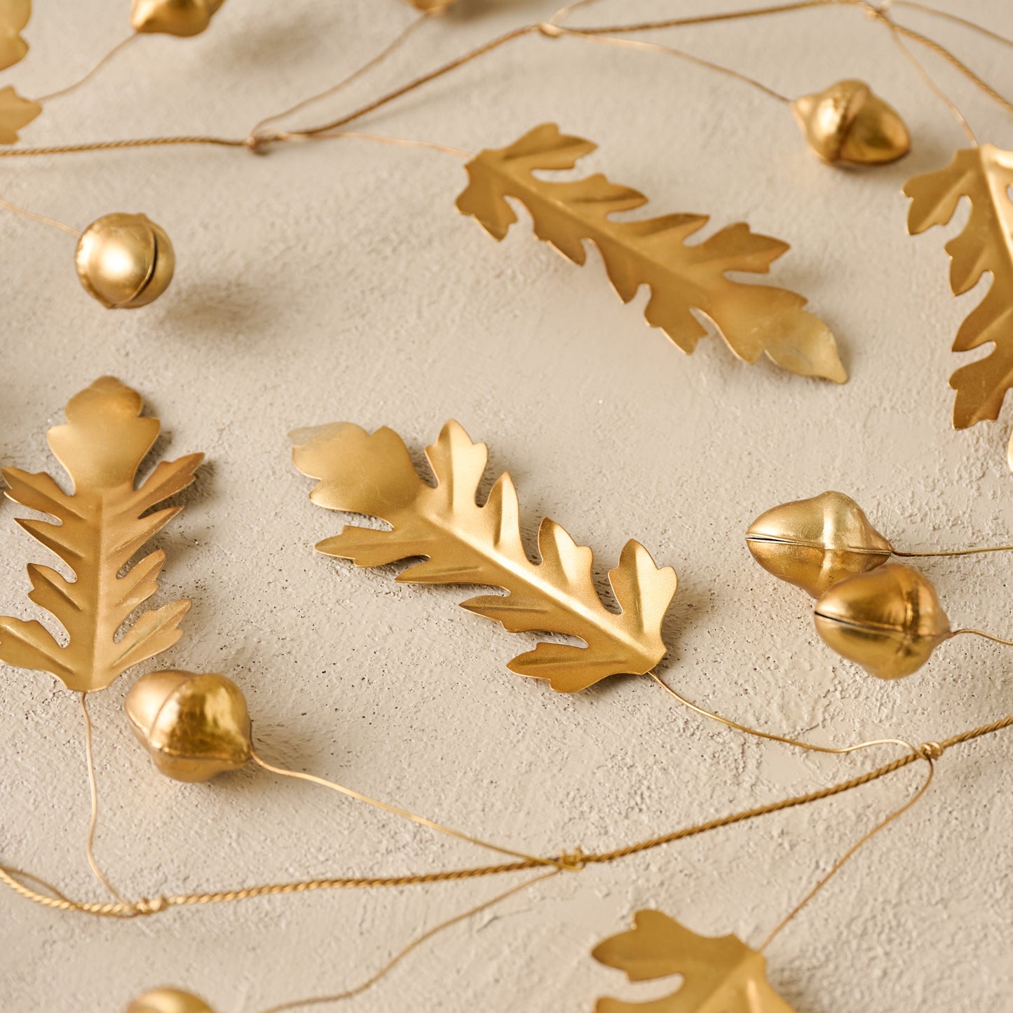 Foraged Leaf and Acorn Brass Garland up close