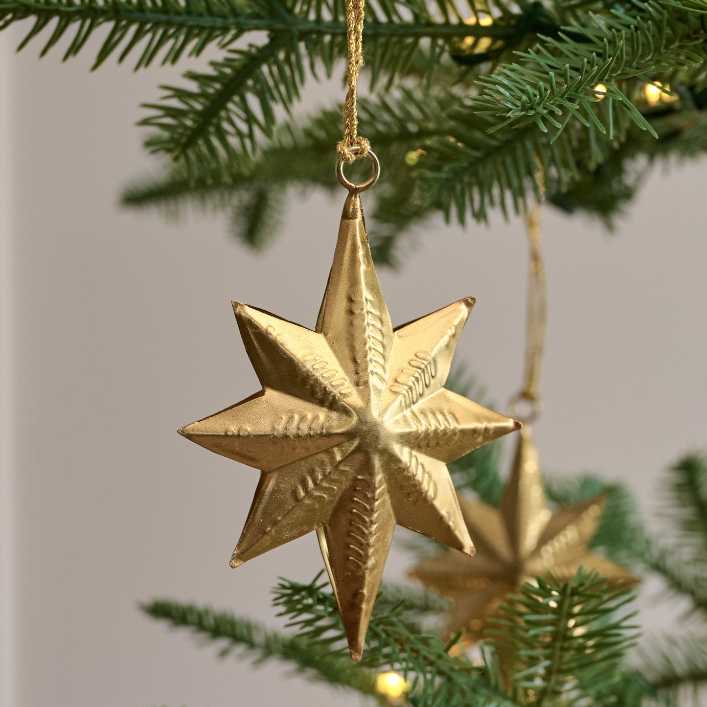 Celestial Star Ornaments, Set of 12 shown hung on tree