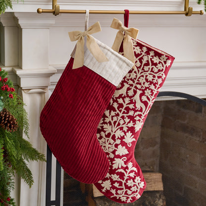 Syrah Enchanted Forest Embroidered Velvet Stocking shown hung above mantel with other stocking