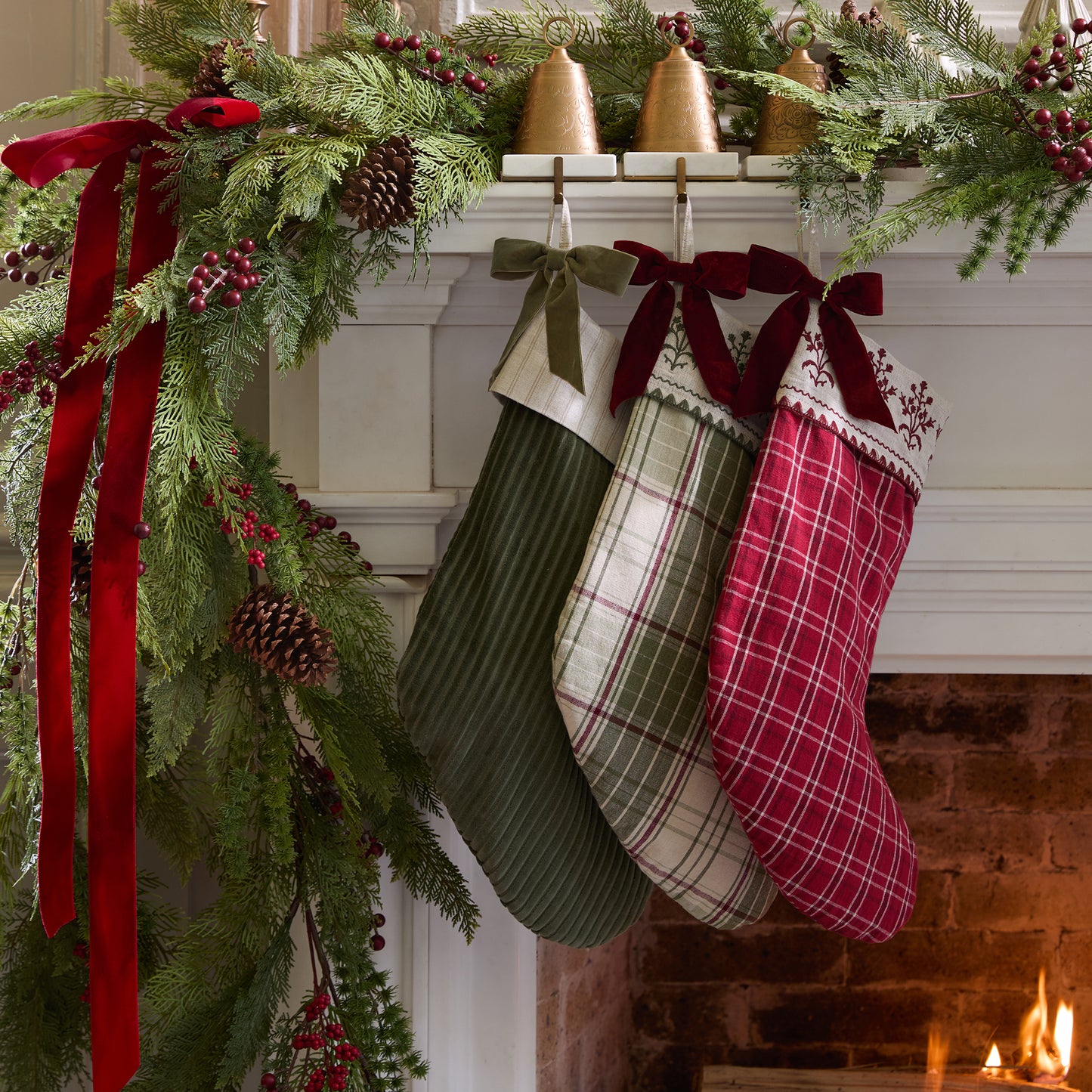 Vintage Festive Plaid Stocking shown hung above mantel with other stockings