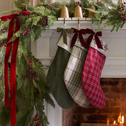Vintage Festive Plaid Stocking shown hung above mantel with other stockings
