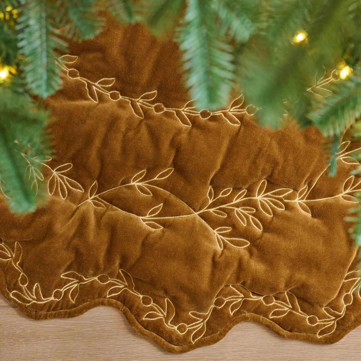 Amber Embroidered Velvet Tree Skirt shown under tree