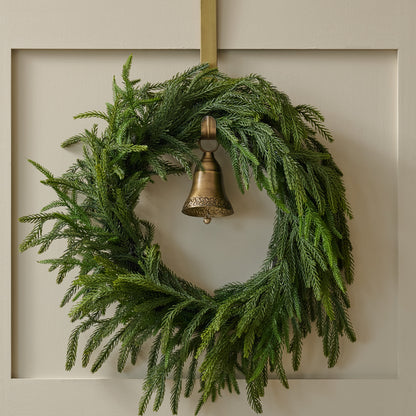 Gabriel Brass Bell Wreath Hanger shown holding wreath