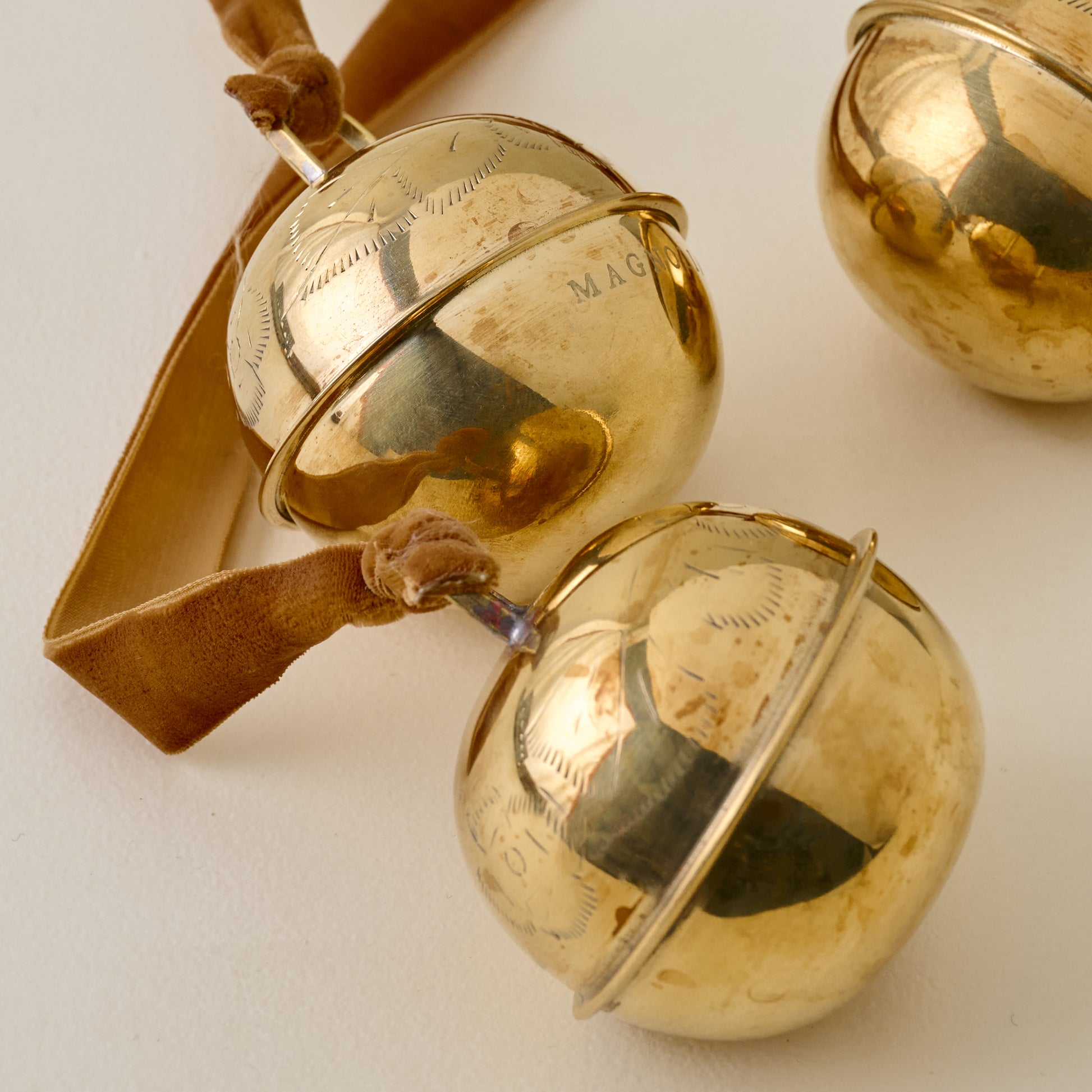 Etched Solid Brass Jingle Bells up close