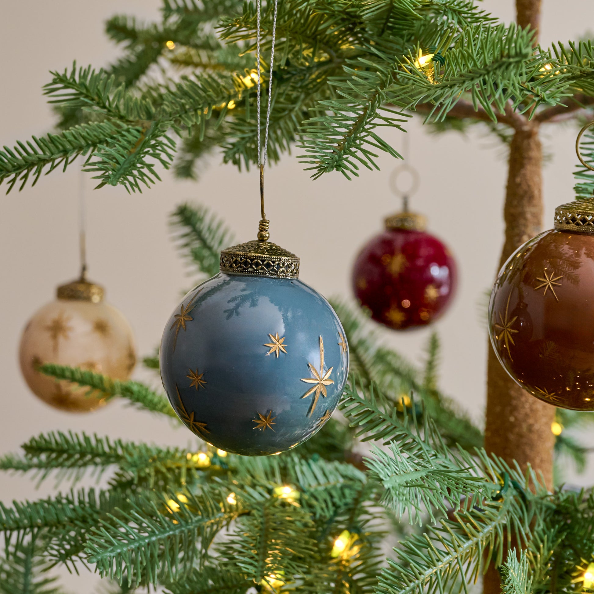 Starry Night Ornaments, Set of 8 shown hung from tree