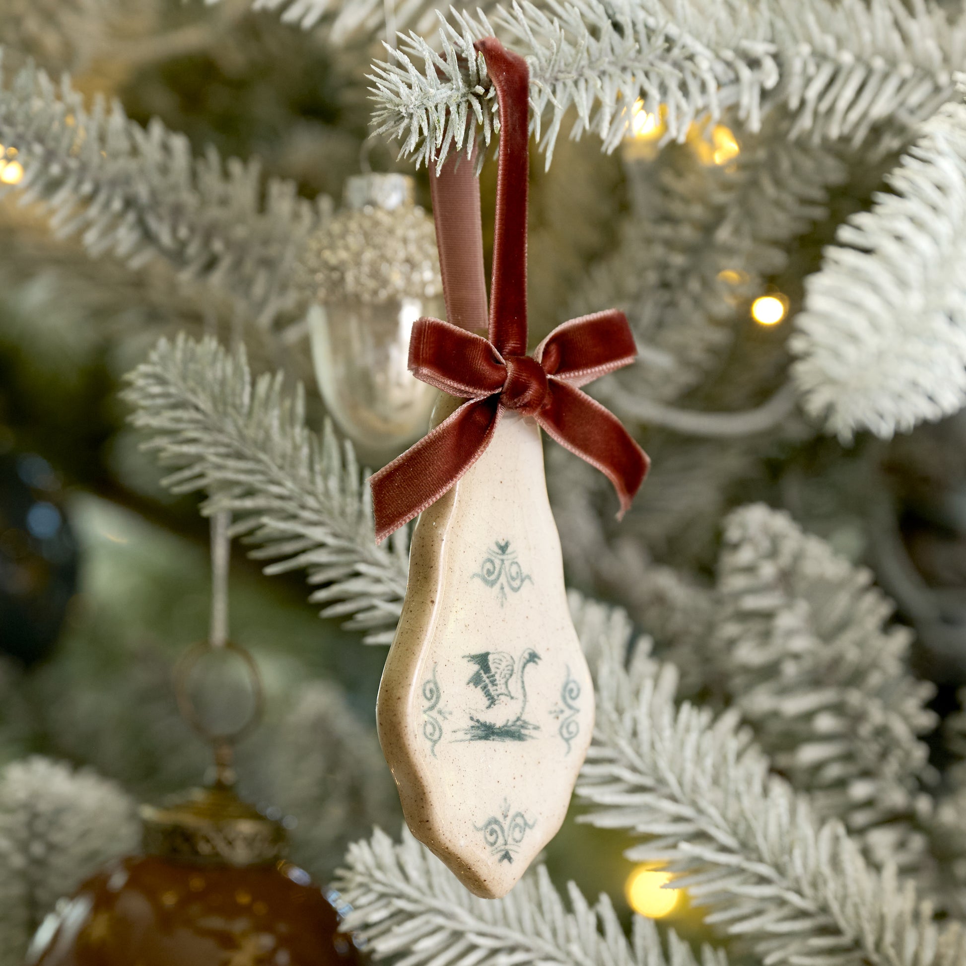 Enchanted Forest Tile Ornaments with red velvet ribbons and animal sketches