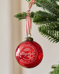 Magnolia Mercury Glass Ornament showhn hung from branch