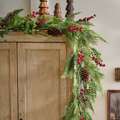 Real Touch Foraged Red Berry Pine Garland - 72" shown on cabinet