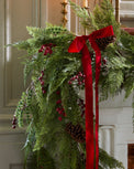 Real Touch Foraged Red Berry Pine Garland - 72" on a mantle