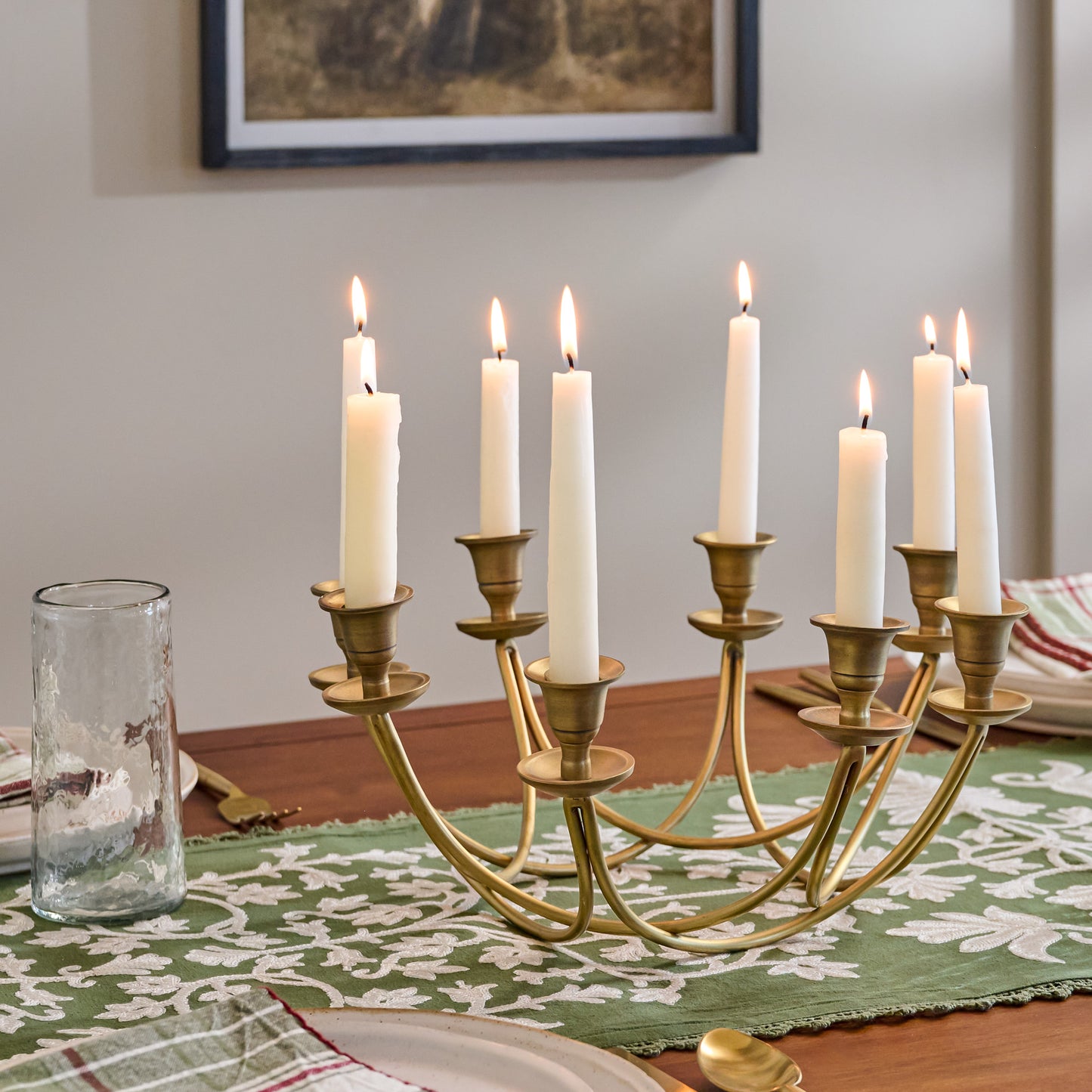 Antique Brass Stacking Candelabra shown on table with candles