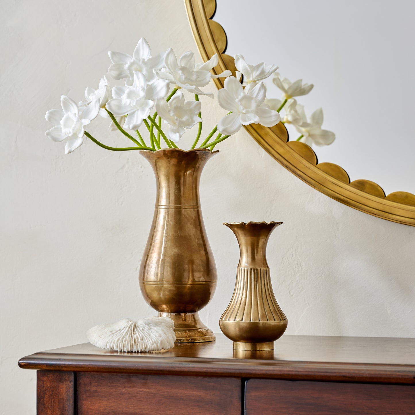 Anna Antiqued Solid Brass Vase (large and small) with whit daffodil flowers on console table