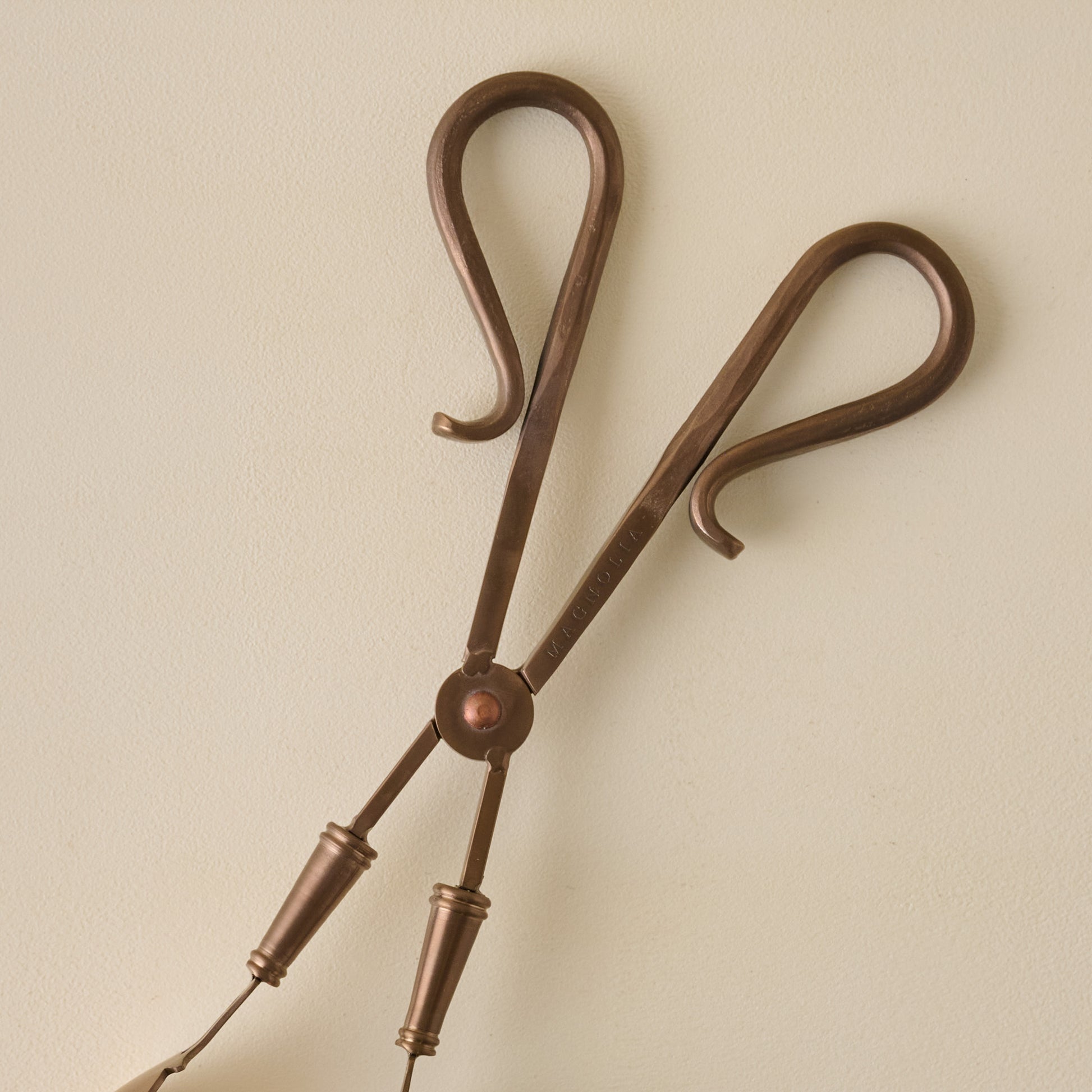 Antique Copper Serving Tongs close up of handles