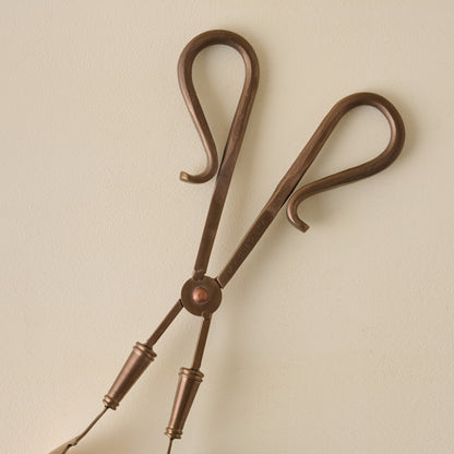 Antique Copper Serving Tongs close up of handles