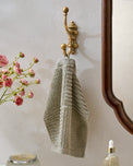 Chloe Solid Brass Wall Hook in a room with hand towel