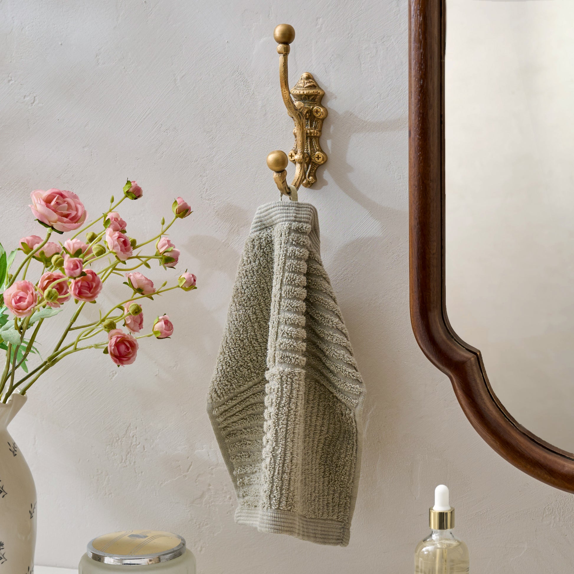 Chloe Solid Brass Wall Hook in a room with hand towel