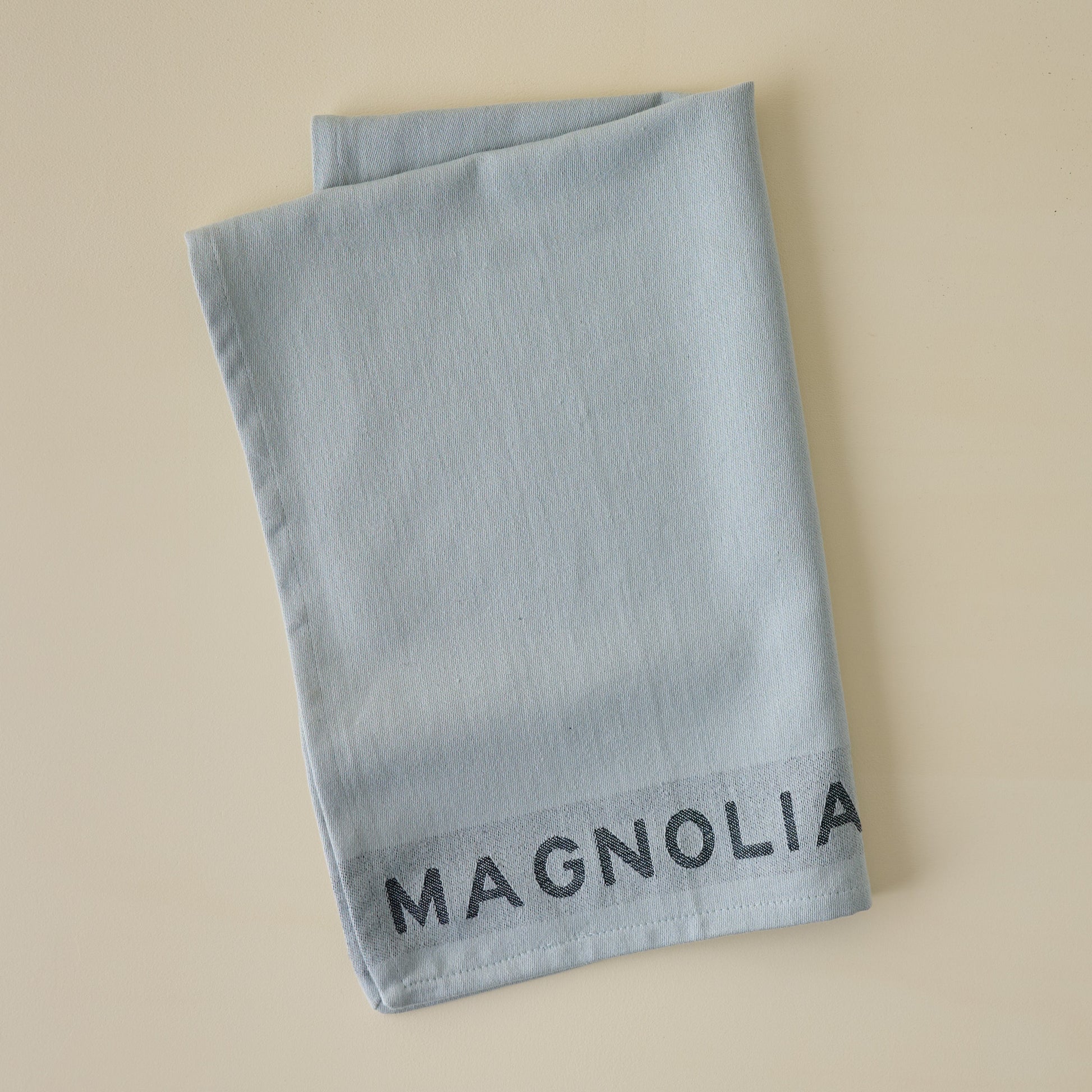 Magnolia Est. Jacquard Tea Towel - Blue folded