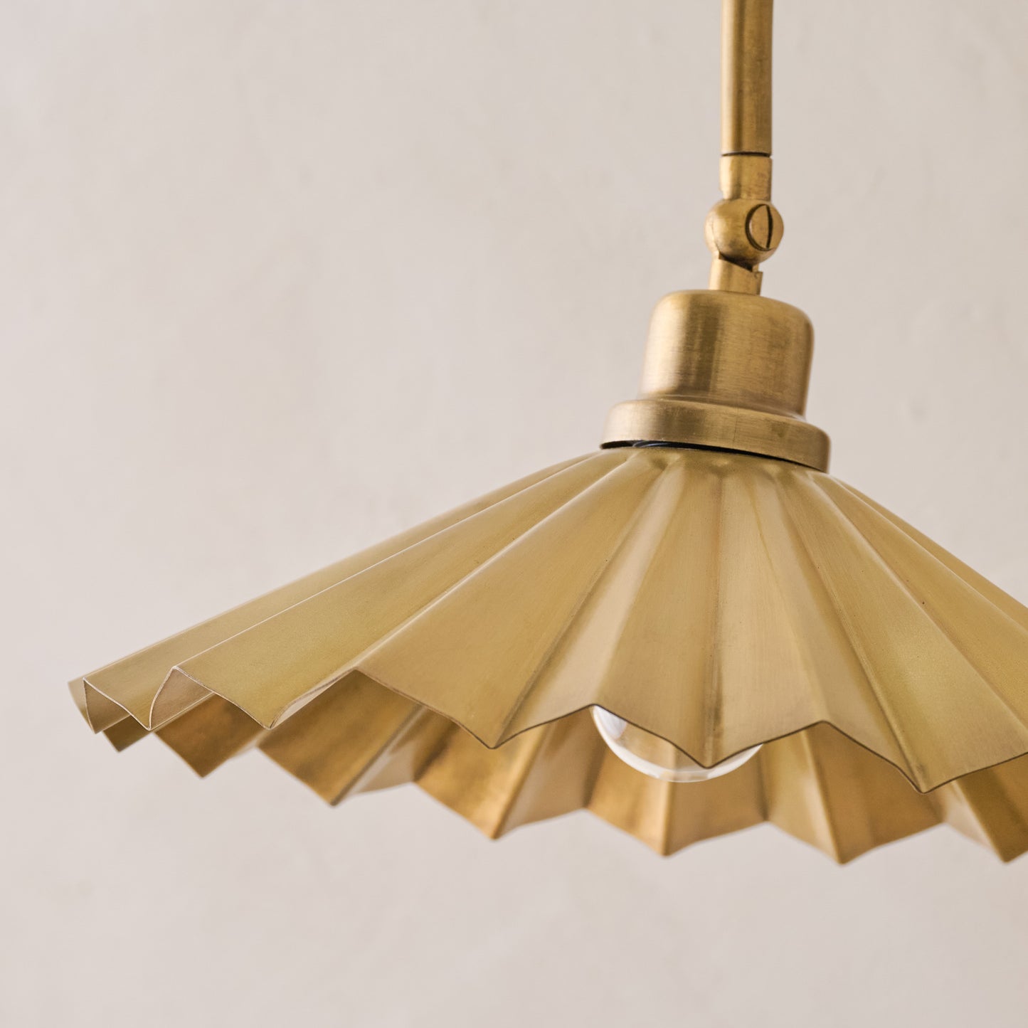 Brass Pleat Plug-in Sconce close up of pleat detailing