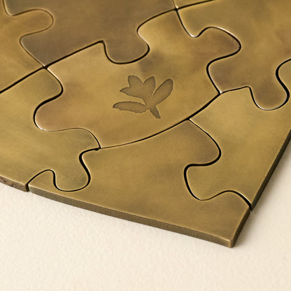 Antique Brass Decorative Puzzle close up view of puzzle pieces