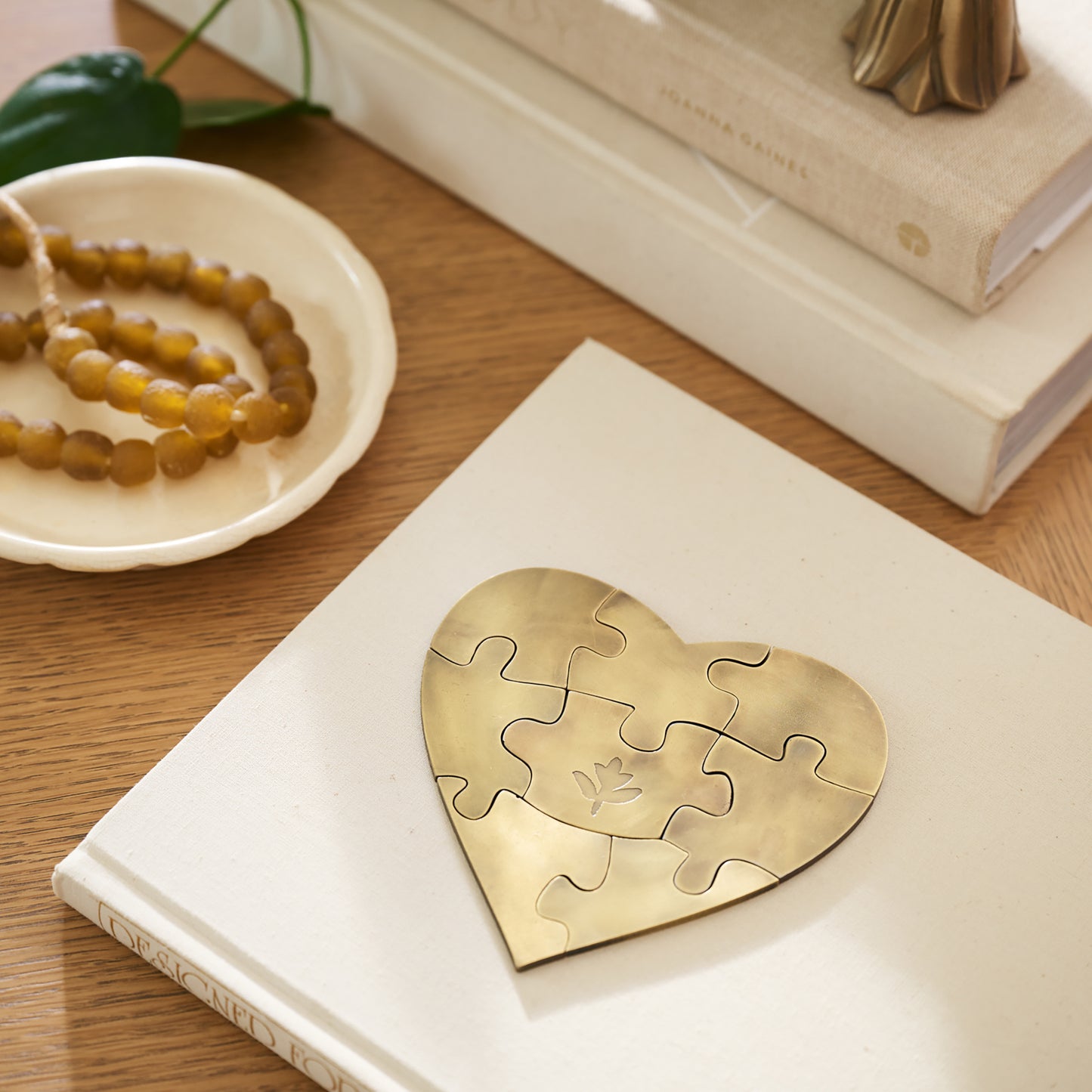 Antique Brass Decorative Puzzle on top coffee table book