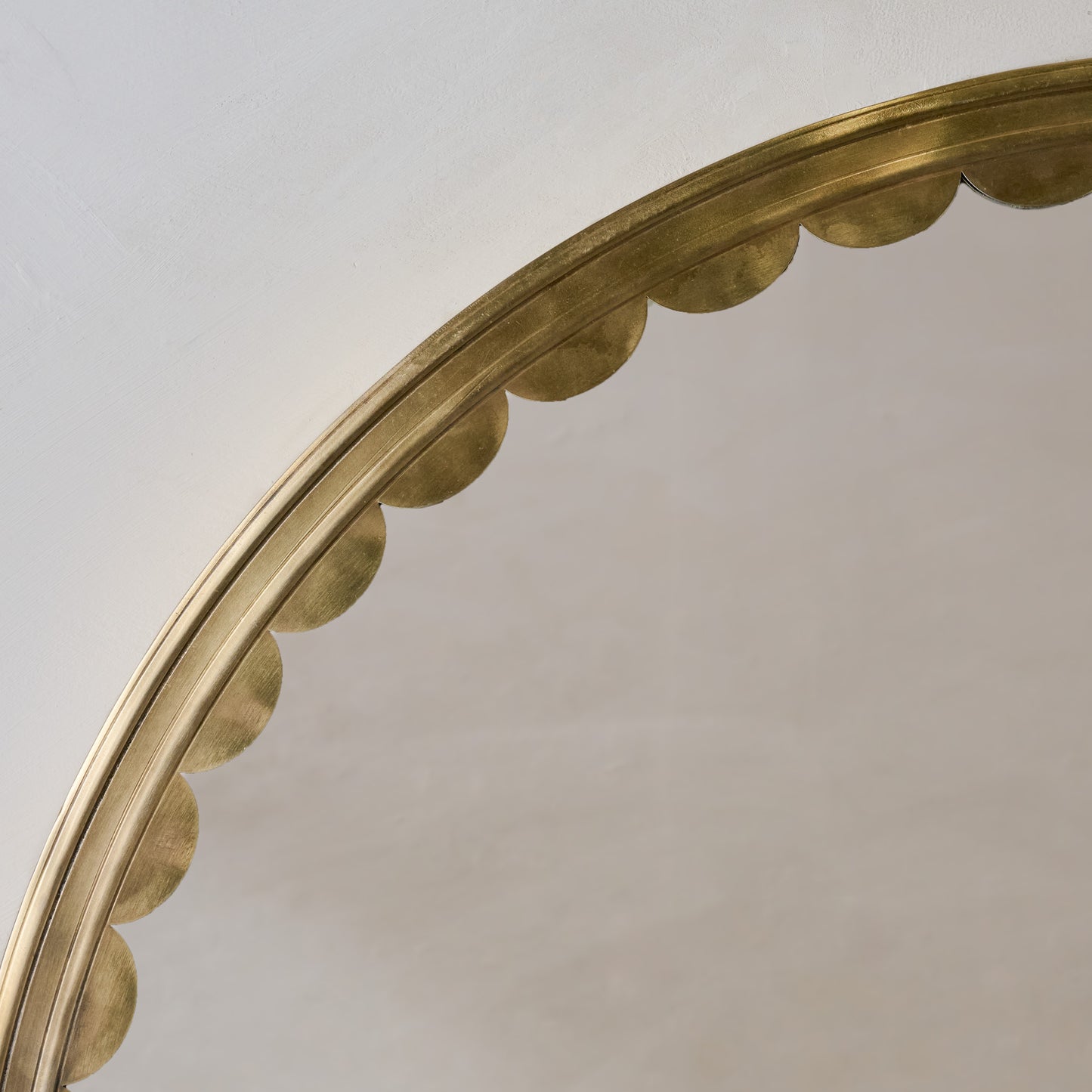 Julie Round Brass Scalloped Mirror close up of scalloped trim detail