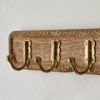 Caroline Carved Wood and Brass Hook Rack close up view