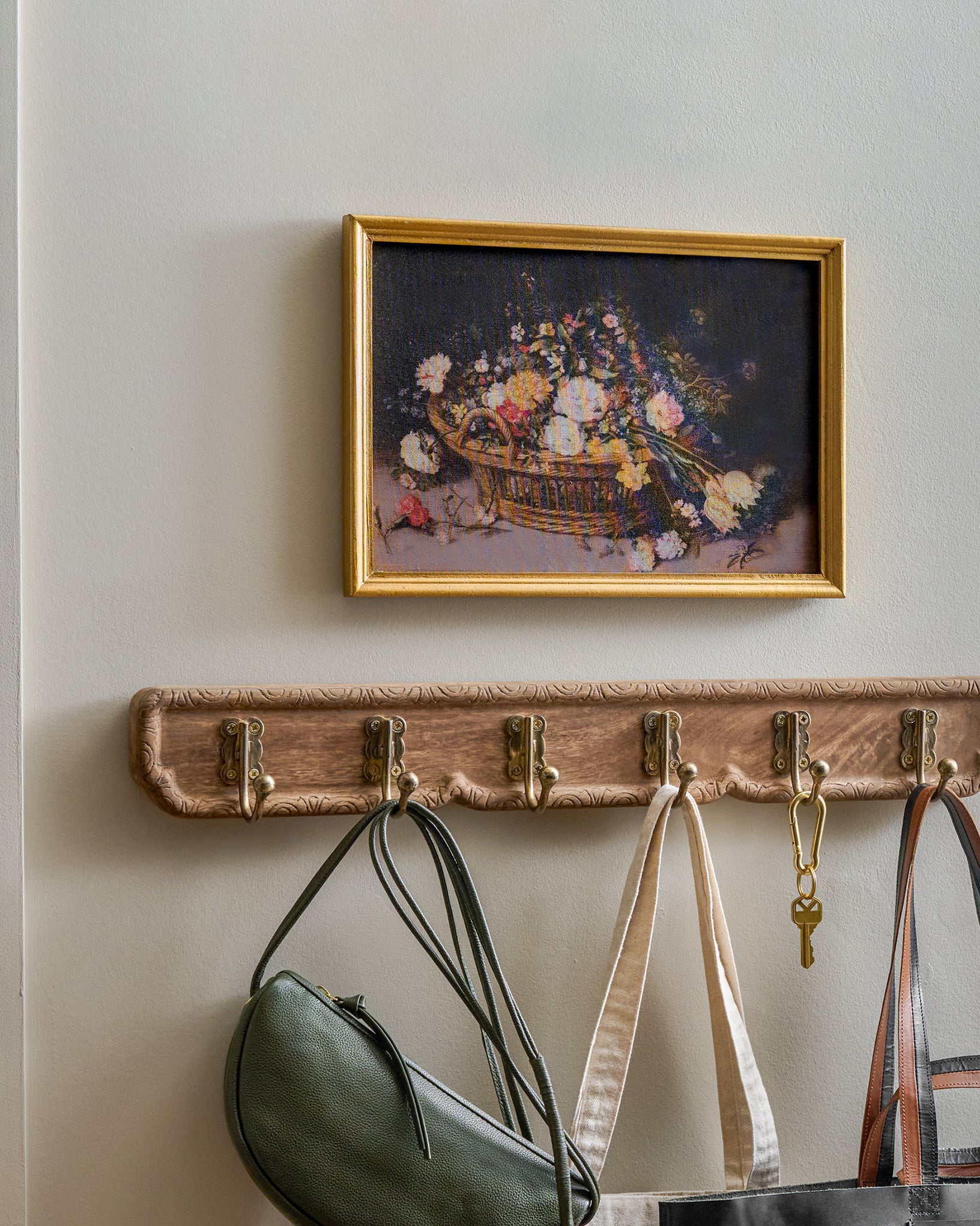 Caroline Carved Wood and Brass Hook Rack in a home