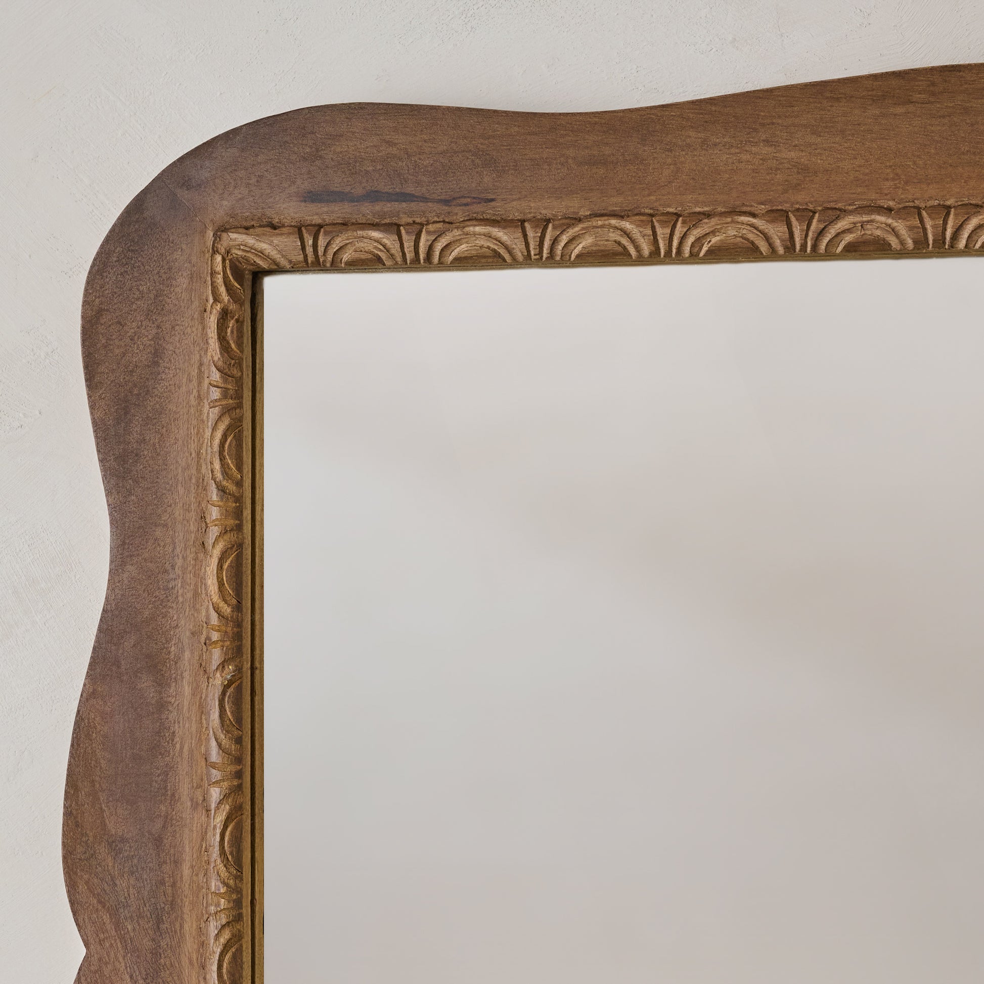 Caroline Carved Wood Mirror close up view of etched wood detail design