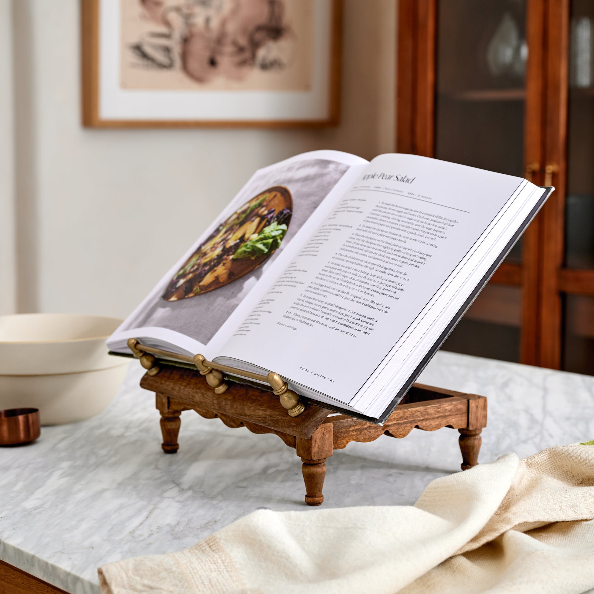 Vintage-Inspired Cookbook Holder + Riser holding an opened cookbook