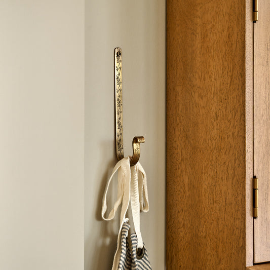 Celine Etched Brass Hook in a room 