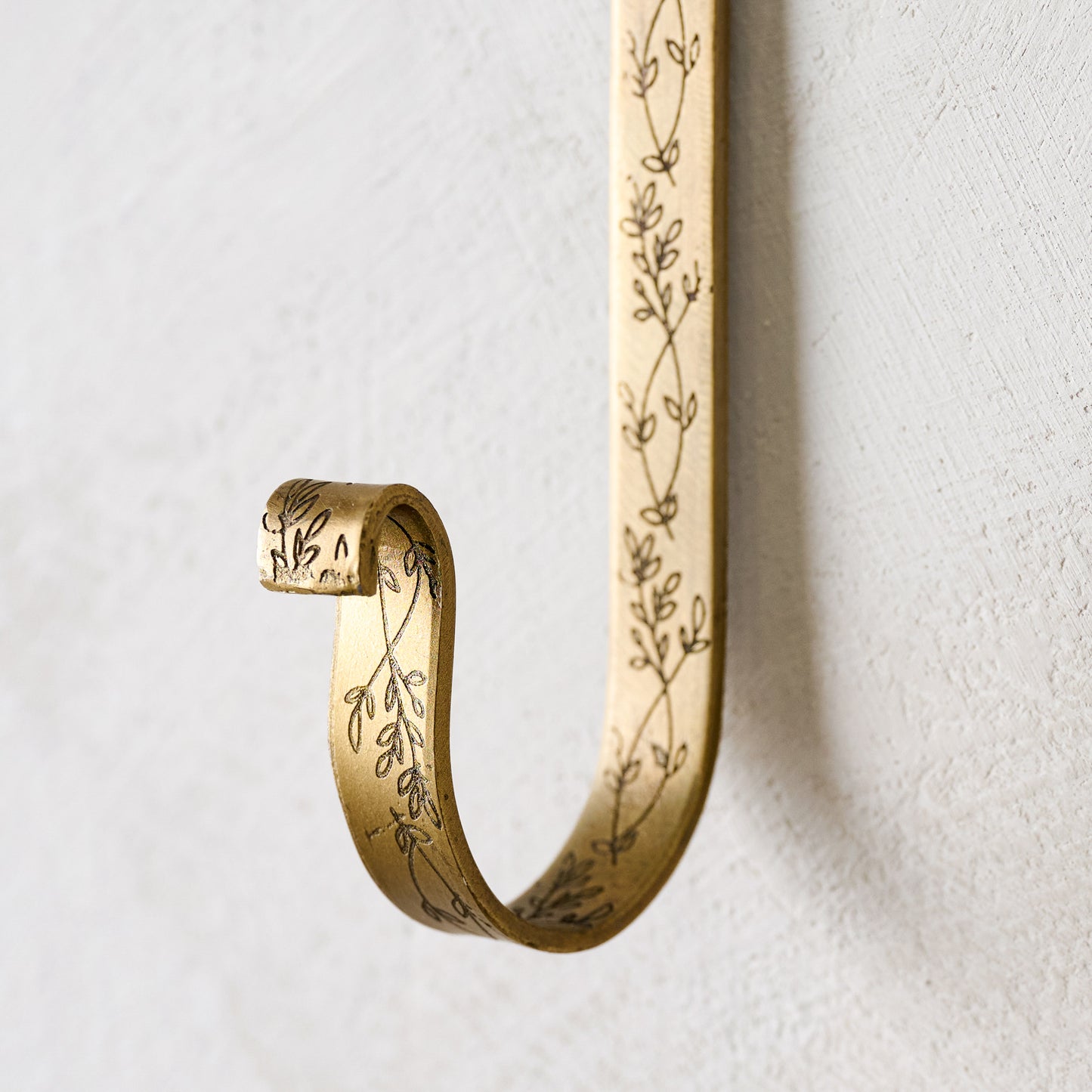 Celine Etched Brass Hook close up of floral motif detailing