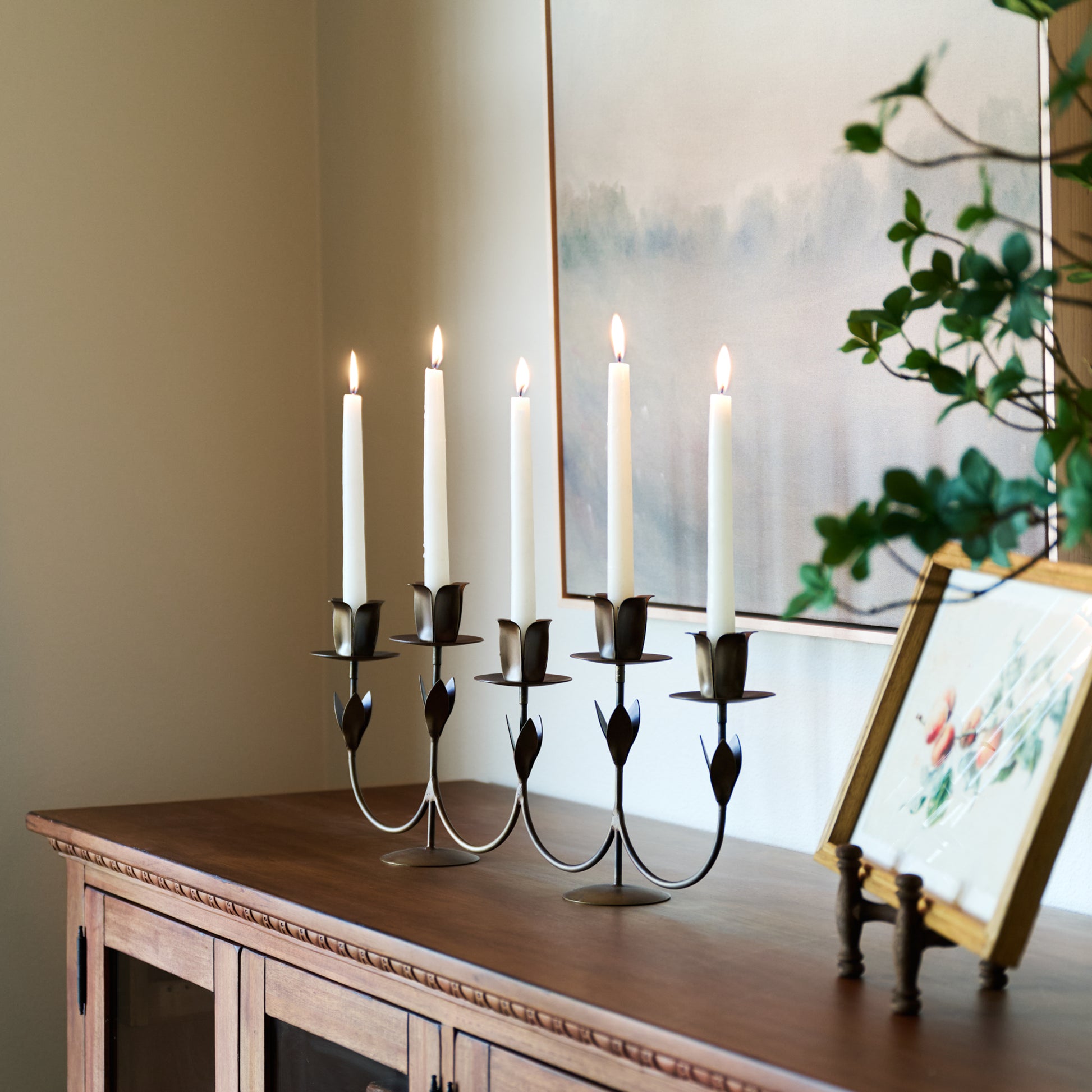 Forged Tulip Candelabra with taper candles lit
