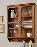 Amelia Oversized Display Cabinet with Glass Doors styled with etched glassware, framed prints and vases