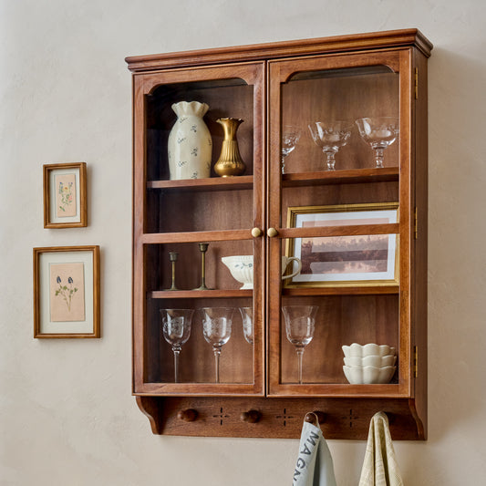 Amelia Oversized Display Cabinet with Glass Doors styled with etched glassware, framed prints and vases