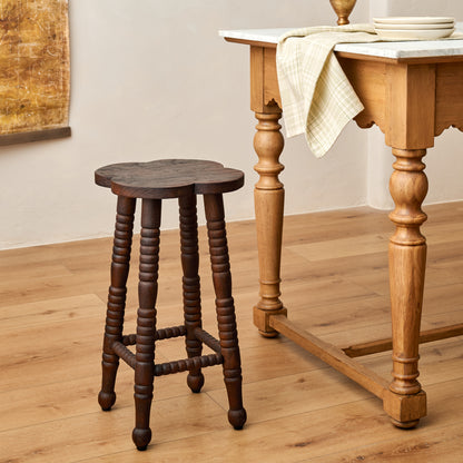Jude Counter Stool in Dark Wood next to kitchen island