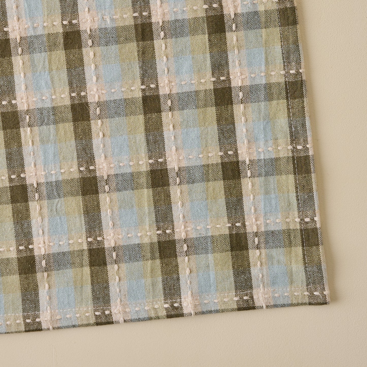 Olive Stone Napkin close up of plaid and stitch detailing