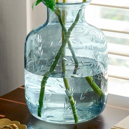 Nora Floral Etched Glass Vase filled with stems on tabletop