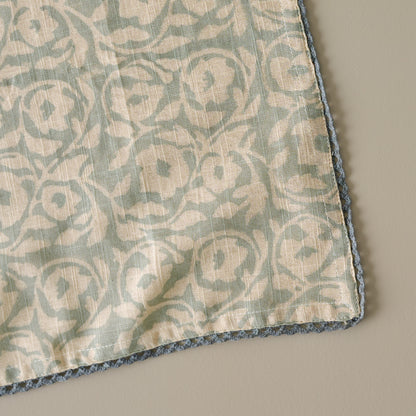 Pivione Fleurs Napkin close up view of floral motif print and border trim