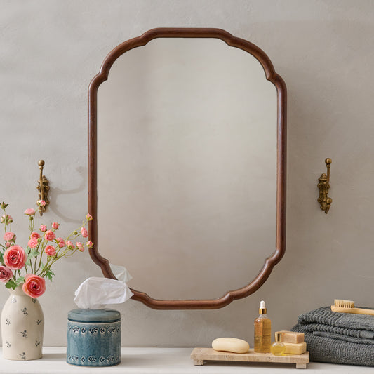 Greer Wood Scalloped Medicine Cabinet (Dark Wood) in a bathroom with floral vase, napkin canister and towels