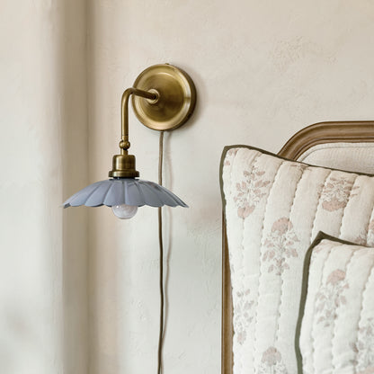 Carolyn Enamel Plug-in Sconce in bedroom next to bed