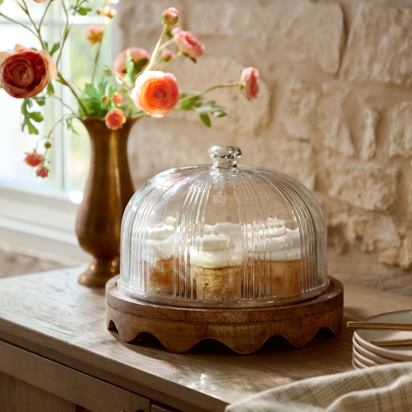 Wavy Edge Cake Stand + Fluted Dome with sweet treats inside sitting on top of sideboard