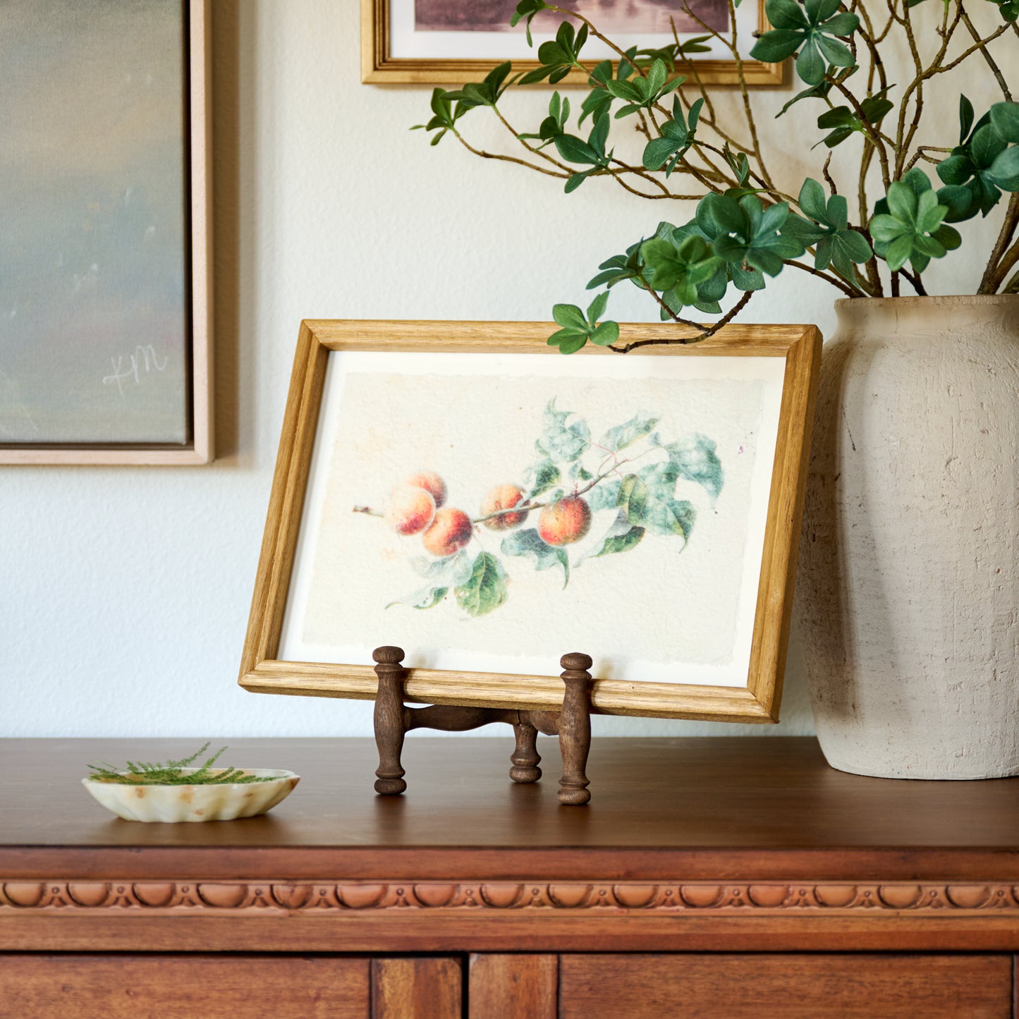 Harrison Antiqued Wood Photo Easel holding framed citrus print