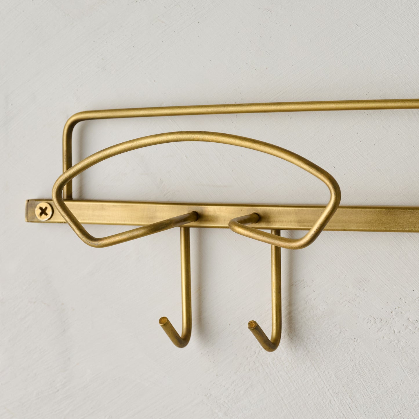 Antique Brass Wyatt Hooks close up view 