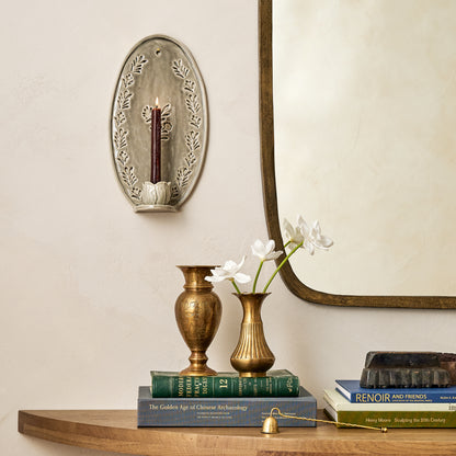 Hallie Floral Ceramic Wall Sconce in a room next to James Mirror 