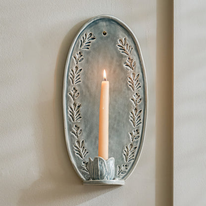 Annie Floral Ceramic Wall Sconce with taper candle lit 