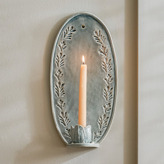 Annie Floral Ceramic Wall Sconce with taper candle lit 